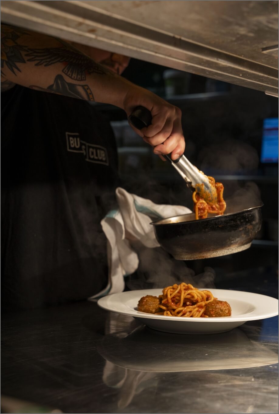 A chef dishing out some food