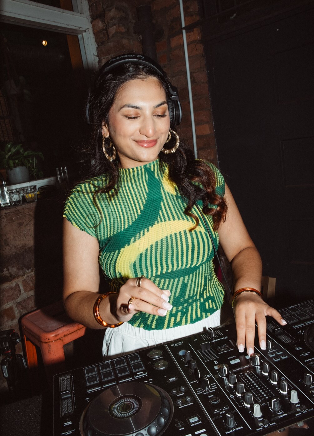 A woman DJing at BC
