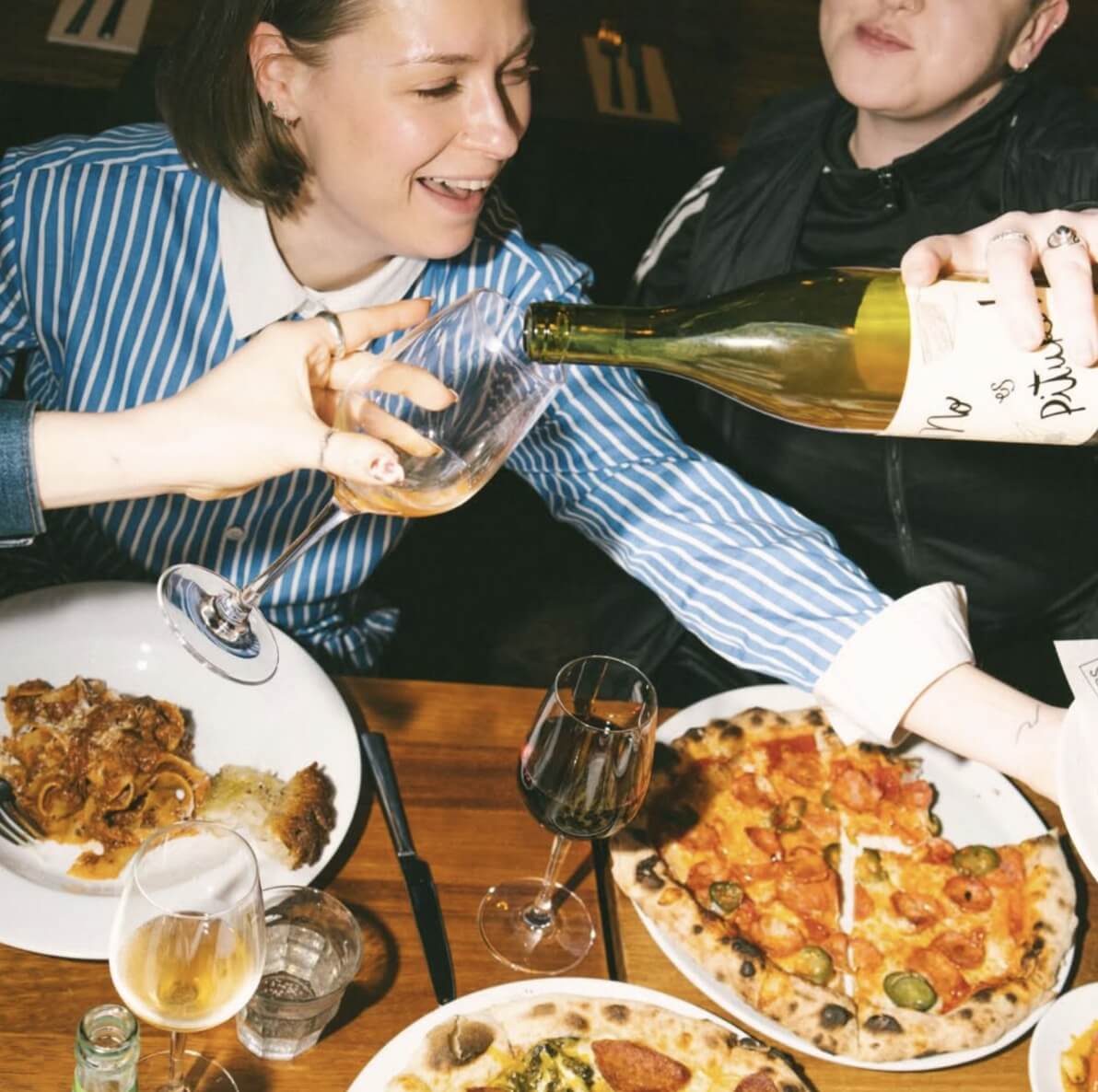 Friends enjoying drinks and food at Buyers Club 2